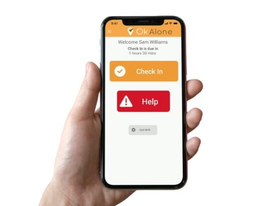 Lone worker using OK Alone alarm app for real-time safety monitoring