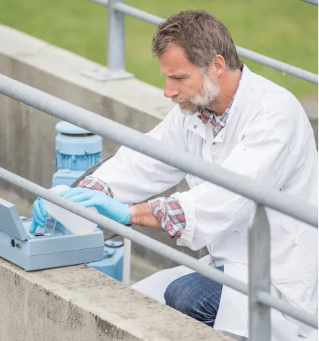 Lone worker taking water samples.