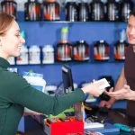 Lone male worker at retail counter