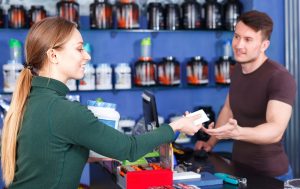 Lone male worker at retail counter