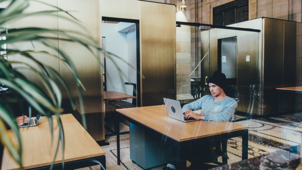 Office worker alone in shared space